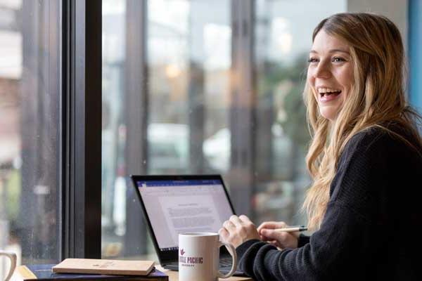 student sits at table